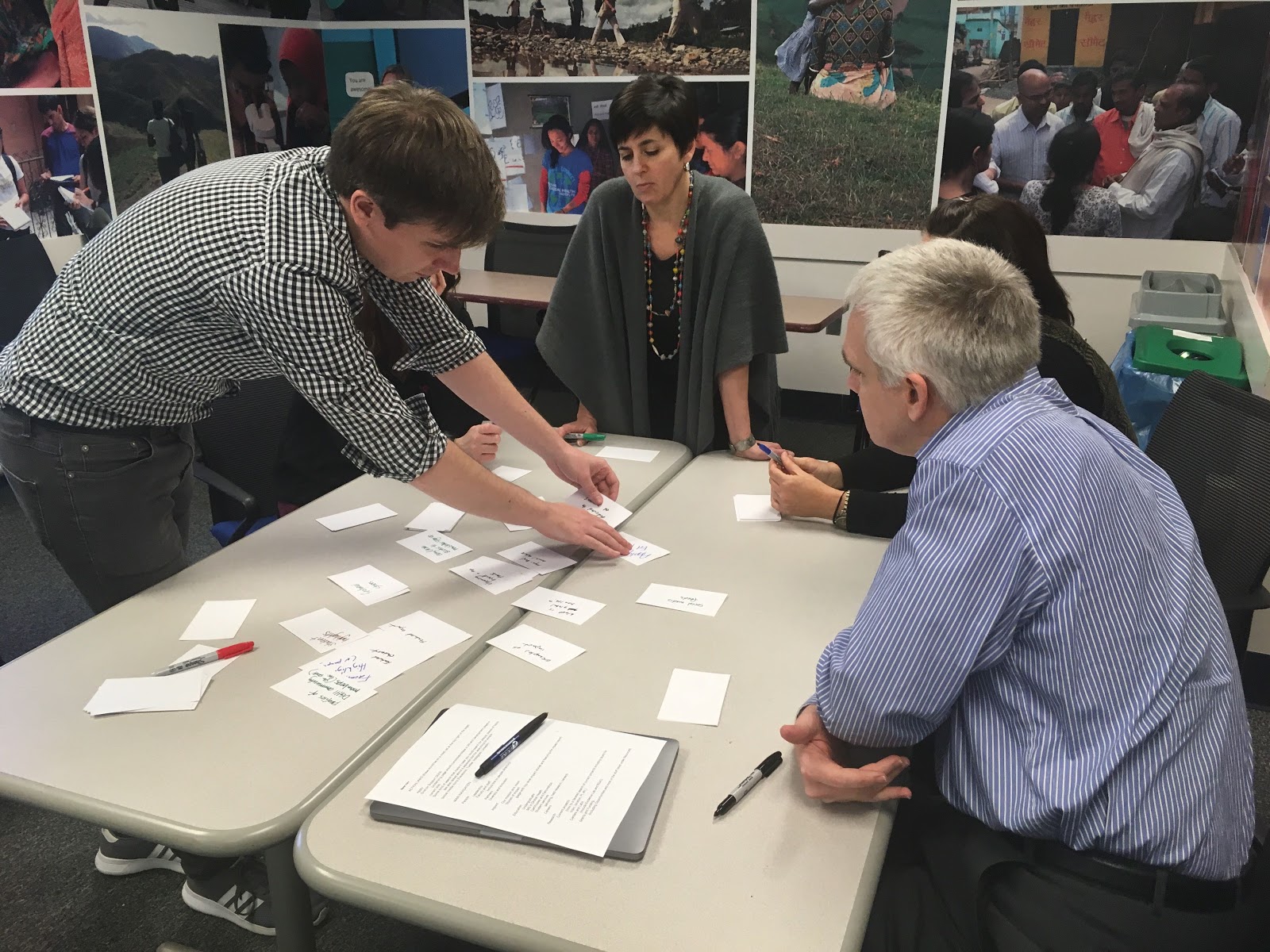 People conducting a card sort exercise