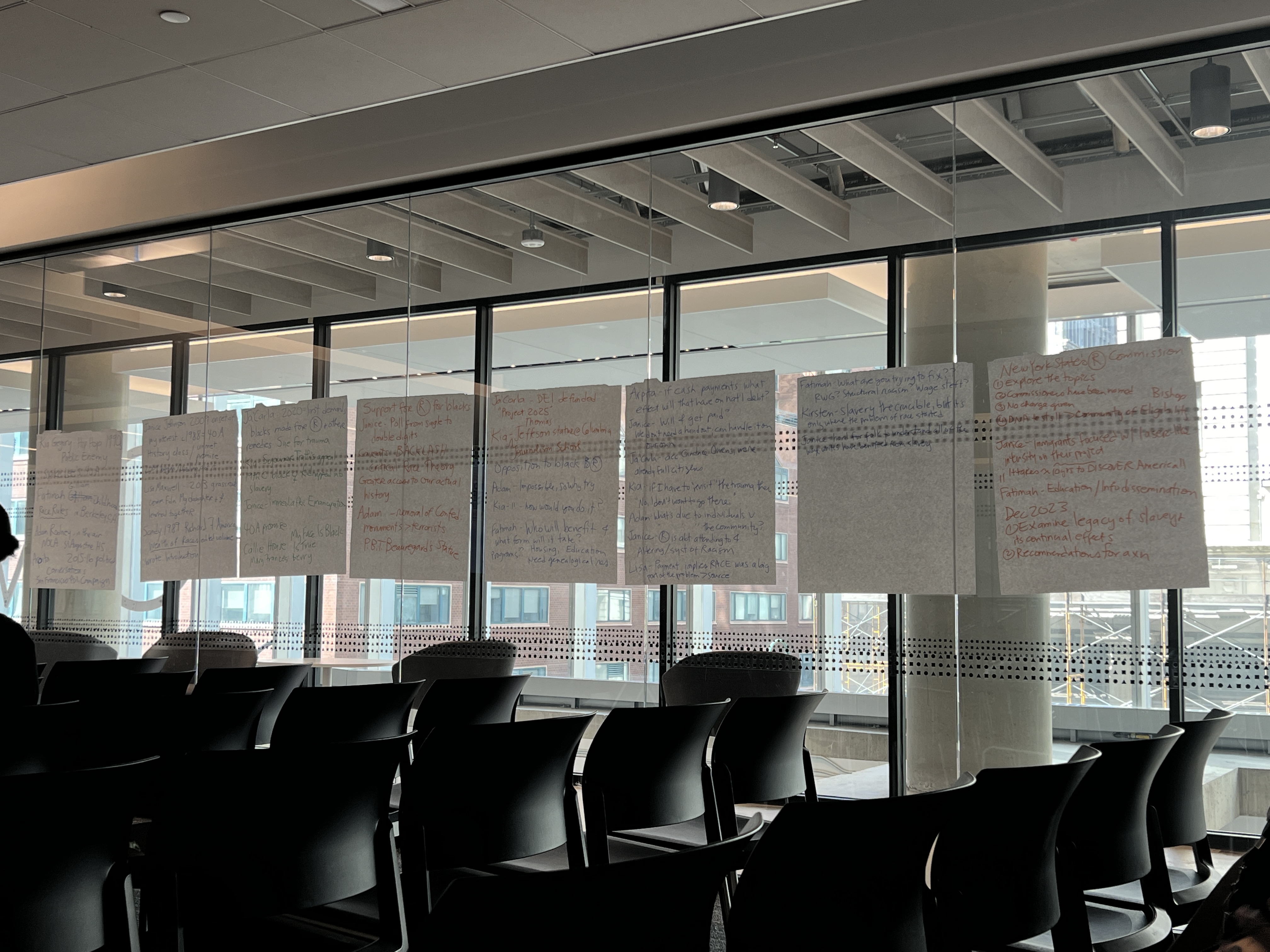 Papers from the workshop sticking to the glass windows