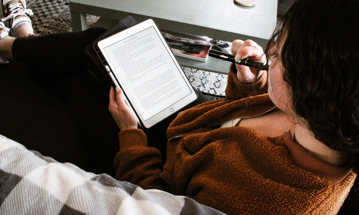 Girl reading a book on a tablet