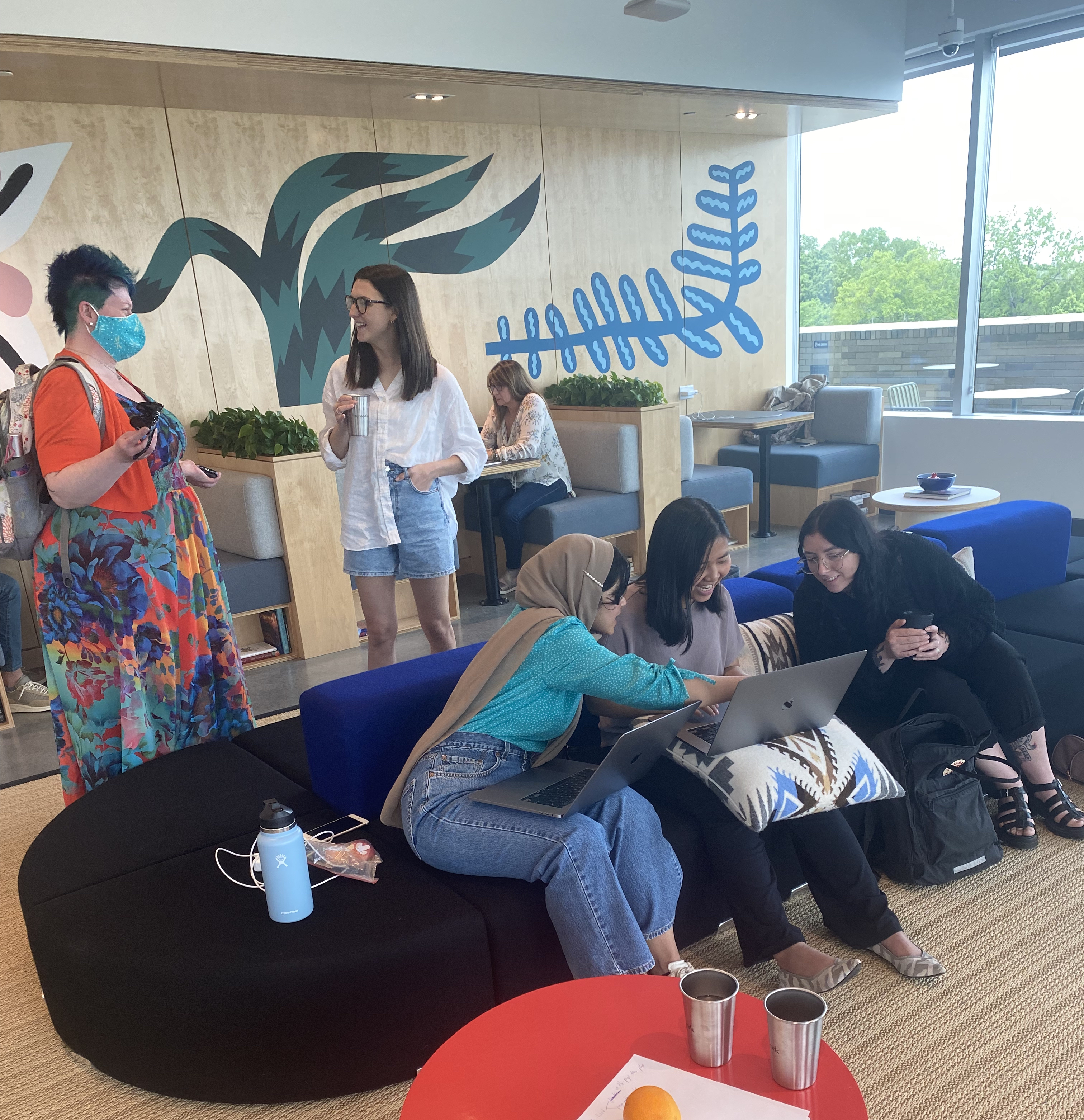 Image of various savas labs employees talking at the office