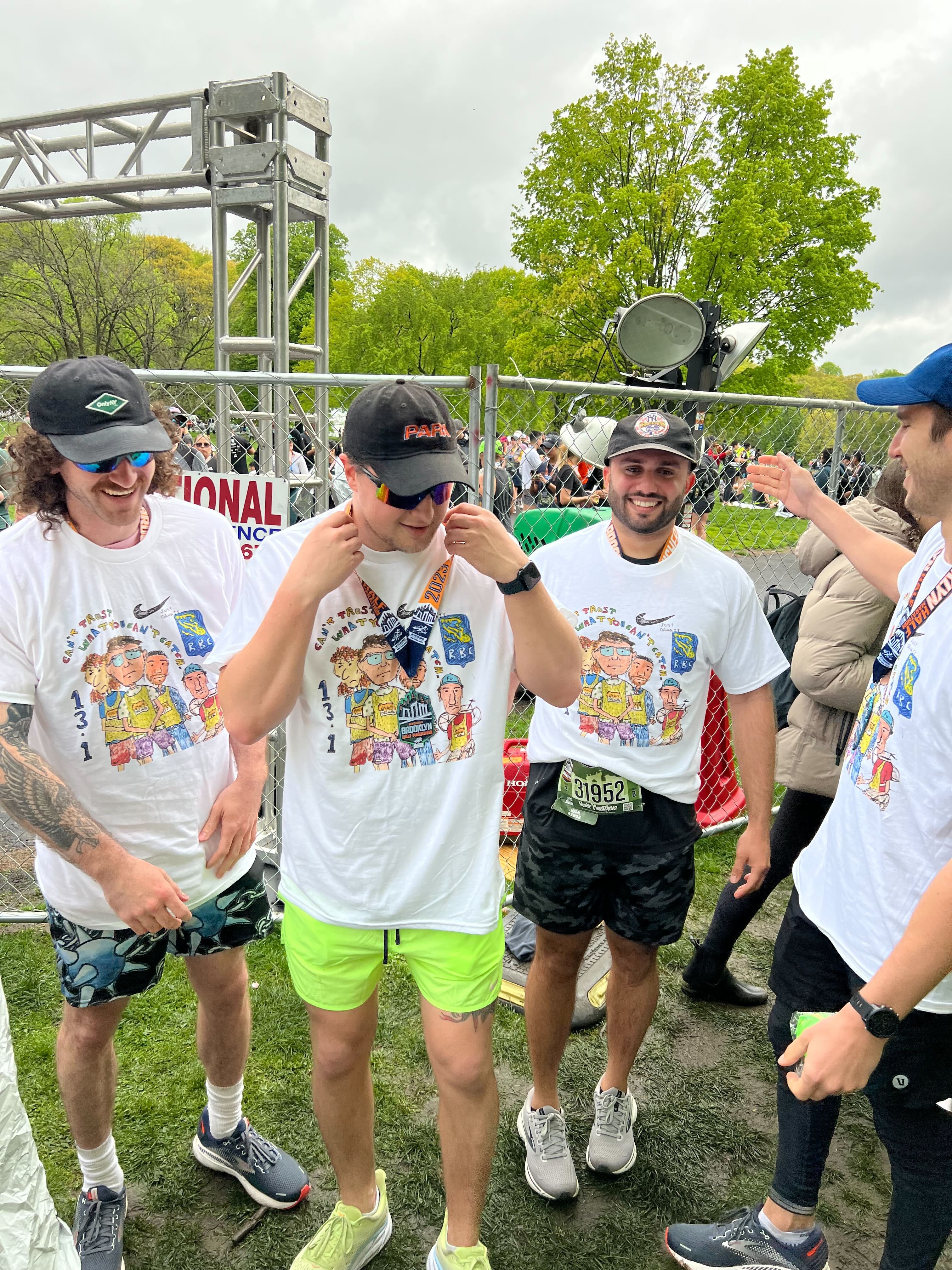 Zakk and friends in a park after running a marathon