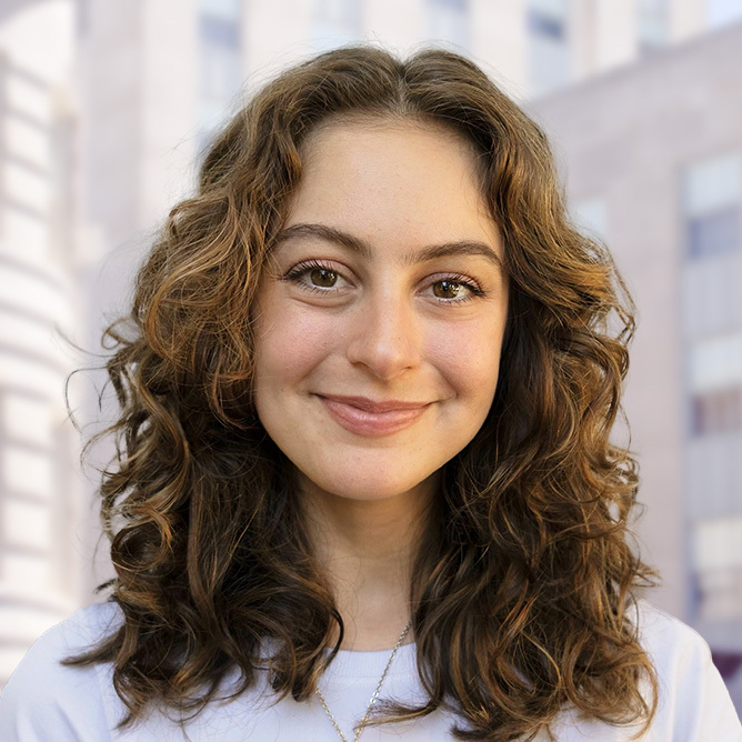 Anabel's headshot with city background