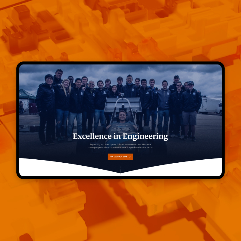 Group of engineering students with one student sitting in a race car.