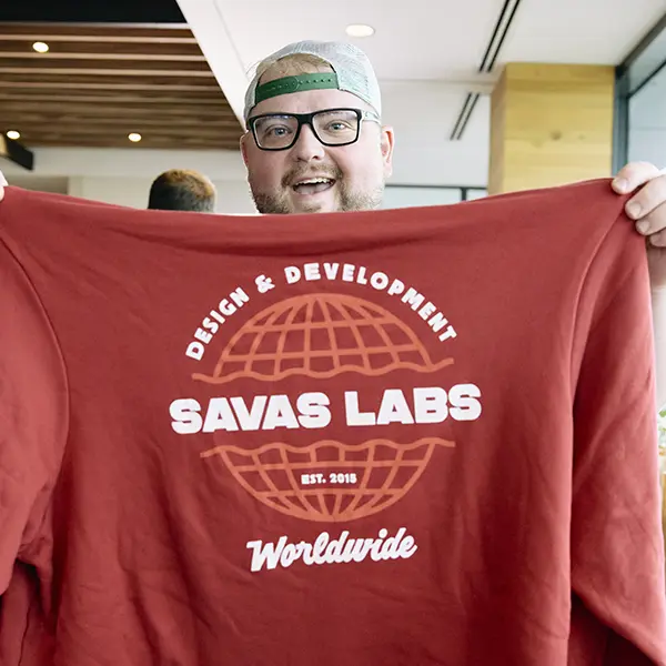 Jayson holding up our Savas hoodie