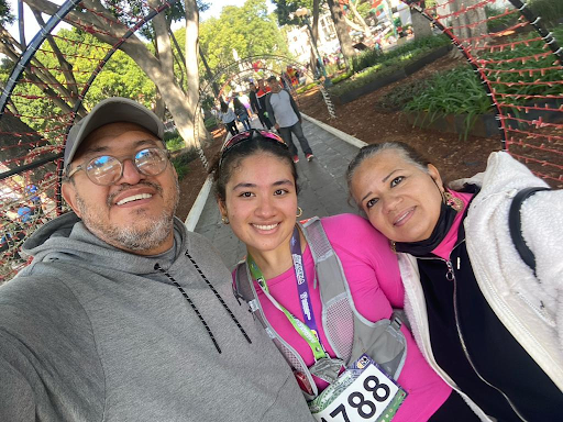 dioceline celebrating a run with her family