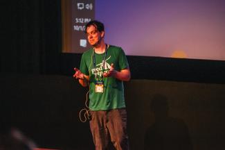 Darrin speaking at a conference in The Netherlands