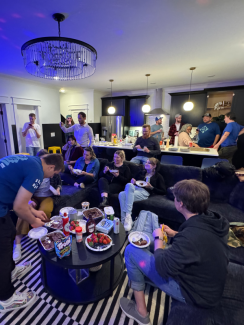 The team in the living room of the Airbnb